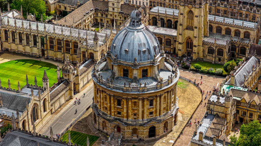 Aerial close-up view of Radcliffe Camera in Oxford with surrounding university colleges, Historic neoclassical dome and medieval architecture, Education and cultural heritage landmark in England